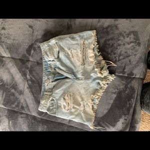 Ripped up denim shorts